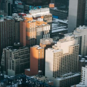Aerial view of downtown Los Angeles with high-rise buildings and rooftops, symbolizing the city's dense concentration of digital agencies.
